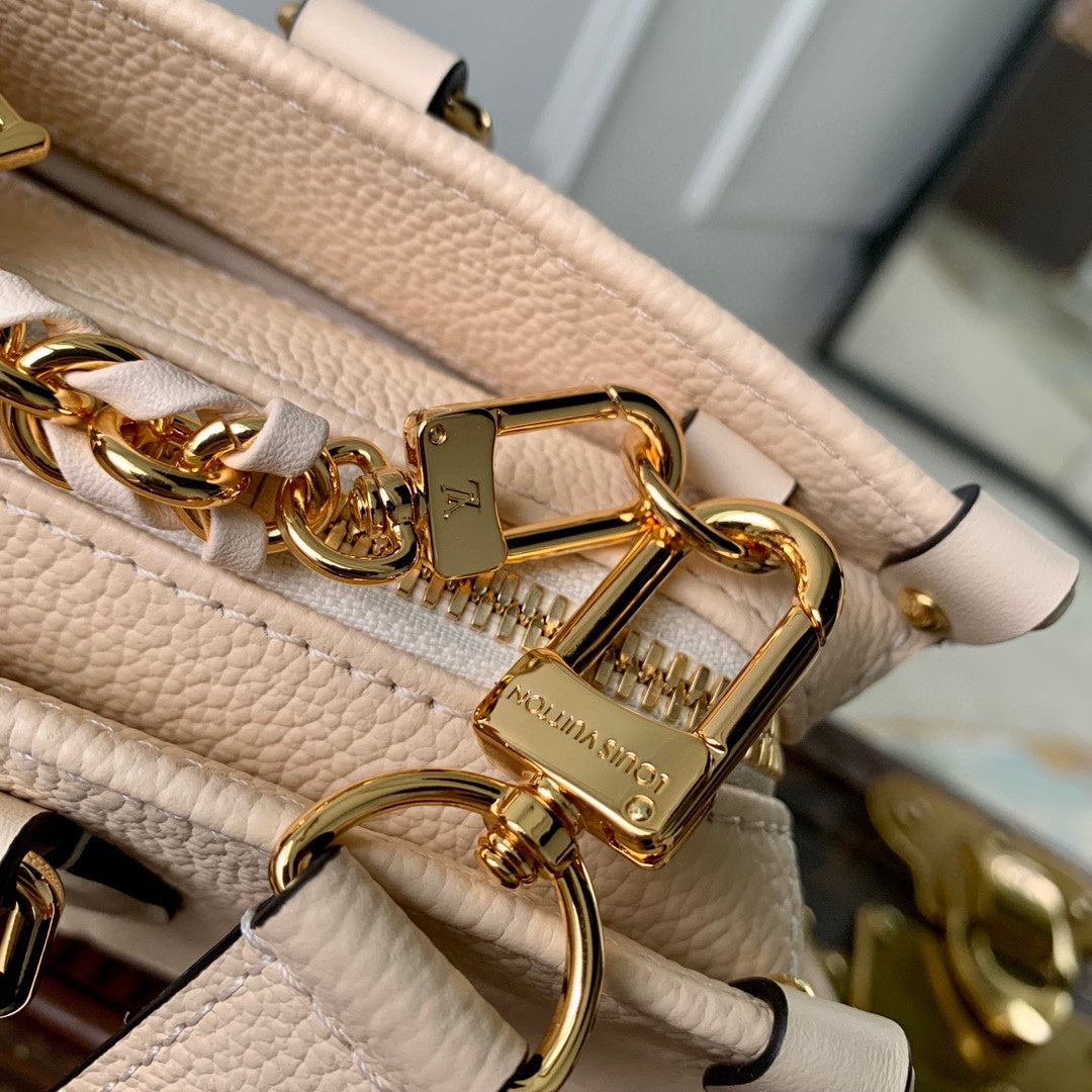 ONTHEGO EAST WEST BAG 25 IN BEIGE MONOGRAM EMBOSSED COWHIDE